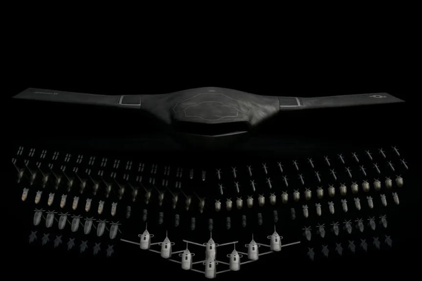 A realistic image of the X-BAT by Shield AI showcasing its full weapons payload under focused lighting on a dark background.